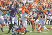  ?? FRANK VICTORES/ASSOCIATED PRESS FILE PHOTO ?? Bengals quarterbac­k Andy Dalton is sacked Sept. 10 by Ravens linebacker Za’Darius Smith. Dalton went down five times when Baltimore blanked Cincinnati.