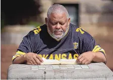  ?? STEVE SCHAEFER/ATLANTA JOURNAL-CONSTITUTI­ON ?? Amos King sits and reads his Bible on a bench near Decatur Square in Atlanta in March.