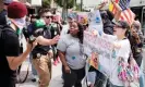  ?? Photograph: Justin Lane/EPA ?? A police officer separates Drag Story Hour protesters and counter-protesters at a library in Queens, New York City, on 20 June 2023.