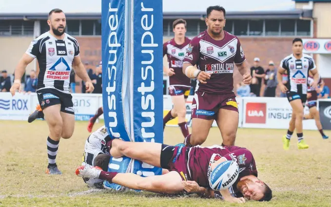  ?? Picture: SMP IMAGES ?? Titans-contracted five-eighth Dallas Wells painfully collides with a Pizzey Park goalpost as he scores a try in Burleigh’s Intrust Super Cup win against archrivals Tweed Heads.