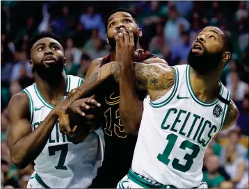  ?? ASSOCIATED PRESS ?? CLEVELAND CAVALIERS CENTER TRISTAN THOMPSON (13) battles for position against Boston Celtics guard Jaylen Brown (7) and forward Marcus Morris (13) during the first quarter of Game 5 of the NBA Eastern Conference finals Wednesday in Boston.