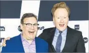  ?? Evan Agostini Invision / Associated Press ?? CONAN O’BRIEN, right, with sidekick/announcer Andy Richter, has signed with TBS through 2022.