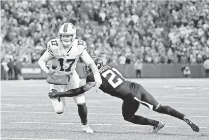  ?? TIMOTHY T. LUDWIG/USA TODAY SPORTS ?? Jaguars cornerback A.J. Bouye dives to try to make a tackle on Bills rookie quarterbac­k Josh Allen in the second half last weekend.