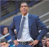  ?? JESSICA HILL/AP PHOTO ?? Ex-UConn head coach Kevin Ollie watches from the sideline during a game on February 7.