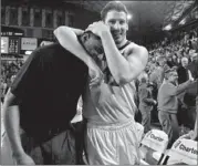  ?? AJ REYNOLDS / AP ?? Georgia forwards Marcus Thornton (left) and Nemanja Djurisic celebrate while walking off the court after beating Kentucky 72-62 on Thursday.