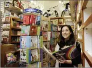  ?? RICHARD DREW — THE ASSOCIATED PRESS ?? In this Monday photo, Judy Ishayik, owner of Mary Arnold Toys, in Manhattan’s Upper East Side, poses for a photo in the store’s book department. Mary Arnold, a nearly 90-year-old store in Manhattan, is thriving along with many other small and...