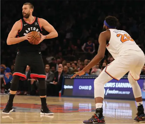  ?? BRAD PENNER/USA TODAY SPORTS ?? Marc Gasol made his debut in a Toronto Raptors jersey Saturday night at Madison Square Garden against Mitchell Robinson and the New York Knicks. Gasol came off the bench in the 104-99 win, but don’t expect the centre to remain on the second unit all season.