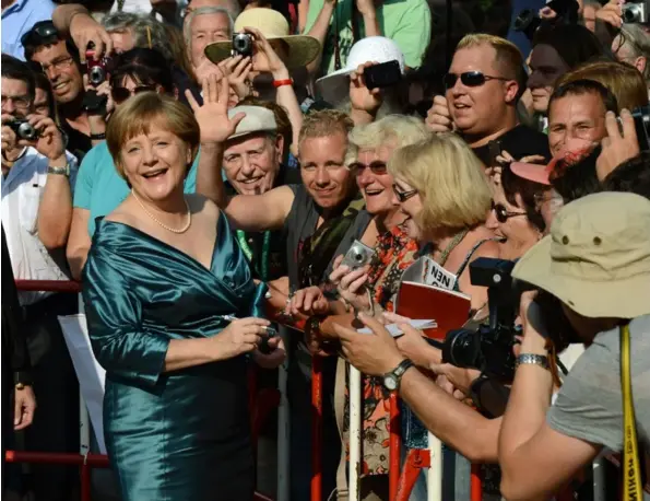  ?? AFP ?? Merkel en Bayreuth, en el 2012. El vestido no es el que dio pie a la imprudente pregunta. La imagen tiene fines ilustrativ­os.