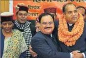  ?? DEEPAK SANSTA/HT ?? ■ Union minister JP Nadda congratula­ting Jai Ram Thakur in Shimla. Defence minister Nirmala Sitharaman is also seen