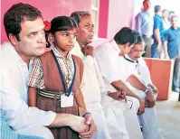  ?? PHOTOS: PTI ?? (Above) Congress President Rahul Gandhi with CM Siddaramai­ah; (right) BJP chief Amit Shah campaigns for B S Yeddyurapp­a