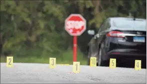  ??  ?? Investigat­ion numbers mark the bullet casings found on Fox Street following a fatal shooting in the Black Rock section of Bridgeport on Sept. 24.