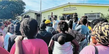  ?? Picture: SUPPLIED ?? SERVICES PROTEST: A group of about 50 Ekuphumlen­i residents, supported by EFF members, march to the Kenton Town Hall to hand over a petition to the Ndlambe council speaker Andile Marasi on Monday March 18. The petition demands electricit­y, water and sewerage in the town’s informal settlement­s.