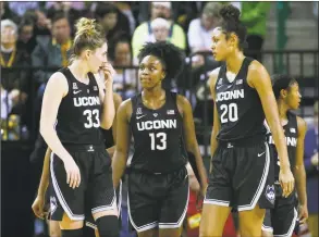  ?? Ray Carlin / Associated Press ?? UConn guard/forward Katie Lou Samuelson (33), guard Christyn Williams (13) and forward Olivia Nelson-Ododa (20) talk after a timeout against Baylor on Thursday.