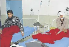  ?? PTI PHOTO ?? Injured passengers undergoing treatment at the government medical college hospital in Jammu on Saturday.