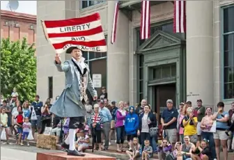  ??  ?? The historical street theater shows take place every hour after Saturday morning’s parade at the Whiskey Rebellion Festival.