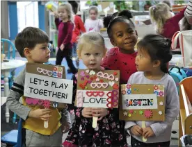  ??  ?? Our young friends march for peace in honor of Dr. Martin Luther King Jr.