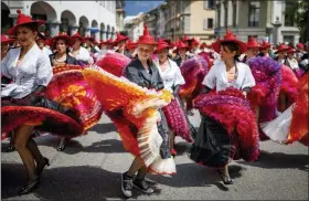  ?? PHOTOS BY VALENTIN FLAURAUD — KEYSTONE VIA AP ?? People take part of the “Fete des Vignerons” (winegrower­s’ festival in French), parade during the official opening parade prior to the first representa­tion and crowning ceremony in Vevey, Switzerlan­d, Thursday. Organized in Vevey by the brotherhoo­d of winegrower­s since 1979, the event will celebrate winemaking from July 18 to August 11 this year.