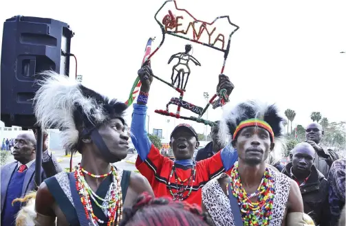  ??  ?? NAIROBI: In this Tuesday, Sept 1, 2015 file photo, traditiona­l Maasai dancers welcome some of Kenya’s athletics medallists back at the airport in Nairobi, Kenya. An IAAF spokesman told The Associated Press in an emailed statement yesterday that it had...