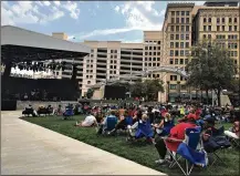  ?? CORNELIUS FROLIK / STAFF ?? The Levitt Pavilion was a hit, attracting about 25,000 downtown during its inaugural season. Some concert-goers visited nearby bars and restaurant­s after the music ended.