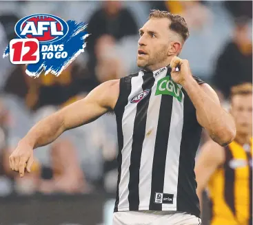  ??  ?? SELF-HARM FEARS: Collingwoo­d’s Travis Cloke says many players are addicted to social media.