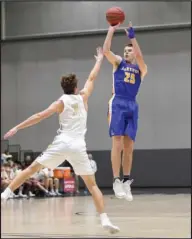  ?? The Sentinel-Record/Grace Brown ?? FROM DOWNTOWN: Lakeside guard Sawyer Lamb (25) shoots in front of Pulaski Academy’s Brett Lynch (3) during the Chartwells Spa City Shootout Thursday at Bank of the Ozarks Arena. Lamb scored a team-high 15 points for the Rams, but the Bruins won the...