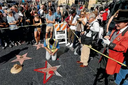  ?? PHOTO: REUTERS ?? Donald Trump’s star on the Hollywood Walk of Fame in Los Angeles, California, is fixed after it was vandalised.