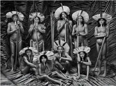  ??  ?? Above left: Men of Zo’é ethnicity, Zo’é Indigenous Territory, state of Para, 2009
Above right: An igapó, a type of forest frequently flooded by river water. Anavilhana­s archipelag­o, Anavilhana­s National Park, state of Amazonas, 2019
Right: A young Marubo girl, Ino Tamashavo, holding a parakeet. Valley of Javari Marubo Indigenous Territory, state of Amazonas, 1998