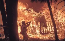  ??  ?? The Camp Fire, pictured, and other devastatin­g California wildfires should remind Arizonans how likely such blazes have become here. NOAH BERGER/AP