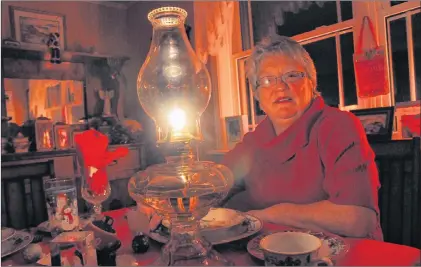  ?? ADAM RANDELL/SALTWIRE NETWORK ?? For the past 52 years Marie Anthony has been holding Christmas Eve supper by the light of a kerosene oil lamp. The tradition began when Marie and her husband, Hal, spent their first Christmas away from Fogo Island.