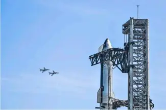  ?? CHANDAN KANNA/AGENCE FRANCE-PRESSE ?? TWO planes do a flyby days before SpaceX’s rocket behemoth Starship launched for its longest flight ever marred by a catastroph­ic return to Earth.