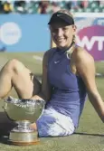  ??  ?? 0 Donna Vekic takes her second trophy of the season.