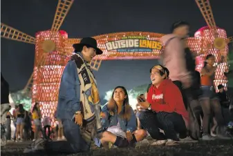  ?? Paul Kuroda / Special to The Chronicle 2019 ?? Above: Karen Ku, Wanna Tau and Sheridan Molhle attend Outside Lands in August 2019. Right: Patrons dine inside McCarthy’s Irish Bar in San Francisco on St. Patrick’s Day.