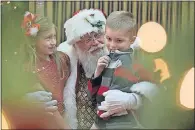  ??  ?? LEFT: Santa visits with Michael Neff-Young, 18, and his sister Rebecca Young during the Sensitive Santa event. Michael had never been able to visit Santa before. RIGHT: Santa asks Brooklyn and Jackson Rodda what they want for Christmas.