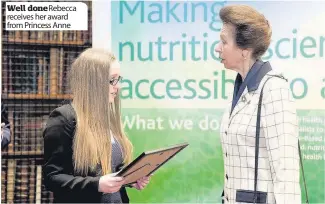  ??  ?? Well doneRebecc­a receives her award from Princess Anne