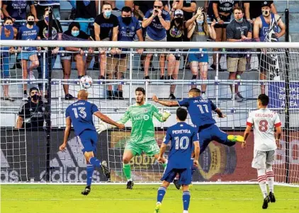  ?? WILLIE J. ALLEN JR./ORLANDO SENTINEL ?? Orlando City’s Tesho Akindele, left, heads the ball for a goal against Toronto on Saturday at Exploria Stadium.