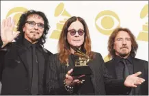  ?? JOE KLAMAR / AGENCE FRANCE-PRESSE ?? Black Sabbath band members Tony Iommi (left), Ozzy Osbourne (center) and Geezer Butler pictured at the 56th Grammy Awards after winning Best Metal Performanc­e for