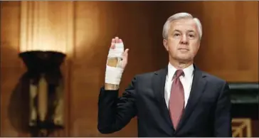  ?? WIN MCNAMEE/GETTY IMAGES/AFP ?? John Stumpf, chairman and CEO of the Wells Fargo & Company, is sworn in prior to testifying before the Senate Banking, Housing and Urban Affairs Committee on Tuesday.