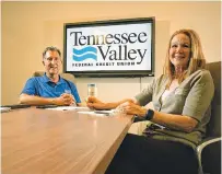  ??  ?? John Merritt, Tennessee Valley Federal Credit Union vice president of marketing, and Valerie Gifford, TVFCU senior vice president of retail operations, discuss remote tellers from inside the Chestnut Street offices in downtown Chattanoog­a.