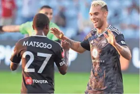  ?? SAM UPSHAW JR./COURIER JOURNAL ?? Louisville City FC'S Cameron Lancaster (17) celebrated with teammate Napo Matsoso (27) after scoring their first goal against Sporting Kansas City II during their match at Lynn Family Stadium on Aug. 19, 2020. Lancaster scored two of Louisville City FC'S four goals against Memphis 901 FC Saturday.