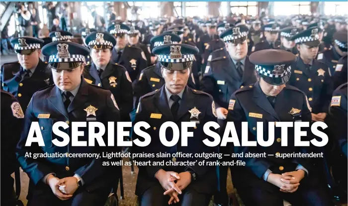  ?? ?? ABOVE: A moment of silence was held Tuesday for slain Officer Andrés Mauricio Vásquez Lasso at a CPD graduation ceremony at Navy Pier.