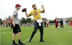  ?? AP ?? LONDON: Washington Redskins quarterbac­k Kirk Cousins, centre, takes part in a training session at Wasps rugby union team training ground. —