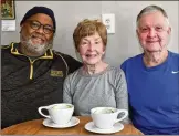  ?? CHRIS HUNT FOR THE AJC ?? Martha and Keith Cameron frequent the Beans & Butter Coffeehous­e in Lawrencevi­lle. Owner Michael Simmons (left) sits with couple.