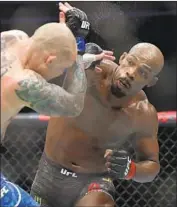  ?? Isaac Brekken Getty Images ?? JON JONES, the UFC’s light-heavyweigh­t champion, is arguably the best pound-for pound fighter.