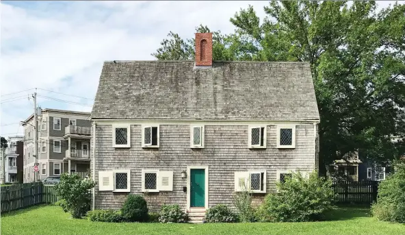  ?? TRaCEE HERBAUGH/THE ASSOCIATED PRESS ?? It is clear just by looking at the exterior of the James Blake House that it is much older than anything else in Boston’s Dorchester neighbourh­ood.