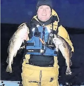  ??  ?? ■ Mark Day with fish taken while kayaking off Whitley Bay