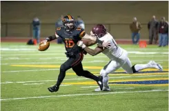  ?? Staff photo by Evan Lewis ?? Atlanta linebacker Tra Darty grabs Gilmer quarterbac­k Zac Spears in the backfield to break up the play during Friday night’s game in Longview, Texas.