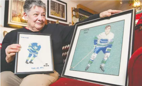  ?? GERRY KaHRMANN ?? Beverly Maki, widow of Wayne Maki, shows her most cherished gifts that were created in memory of the late Vancouver Canucks winger, who died in 1974 of a brain tumour.