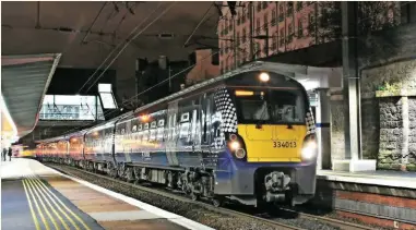  ?? CARL CHAMBERS. ?? Lack of train paths from Haymarket has been an obstacle to reopening, says Alan Woodburn. ScotRail 334013 waits at Haymarket with a westbound train.