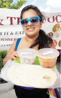  ?? GREG SOUTHAM/ EDMONTON JOURNAL ?? Damini Mohan, from Mini Kitchen, makes Thai and Indian food that you can take home — all frozen for safety — from the Southwest Edmonton Farmers Market.