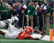  ?? (AP/Roger Steinman) ?? Oklahoma State running back Dezmon Jackson (right) attempts to reach the end zone, but was stopped short by Baylor safety Jairon McVea in the fourth quarter Saturday at AT&T Stadium in Arlington, Texas. Baylor won 21-16.